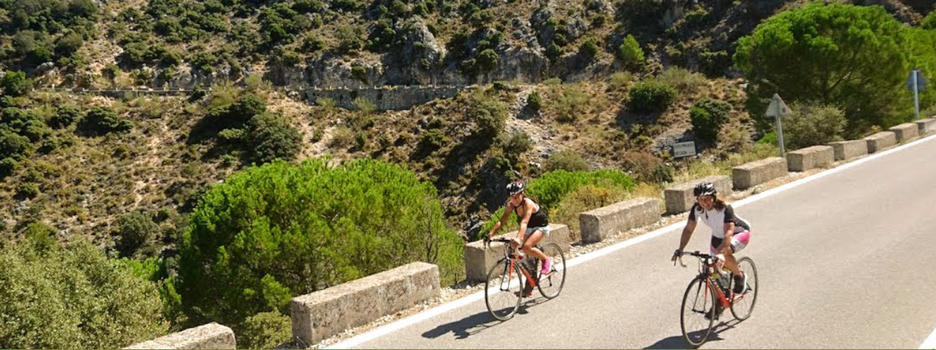 Road cyclists on cycling training retreat in Spain in mountains near Ronda, Andalucia