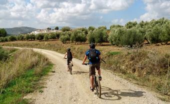 riding towards Olvera MTB tour in Andalucia