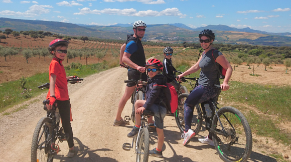 family riding bikes.in spain