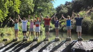 Walking group on the Henderson Way walk in the Rio Guadiaro near Ronda in Spain
